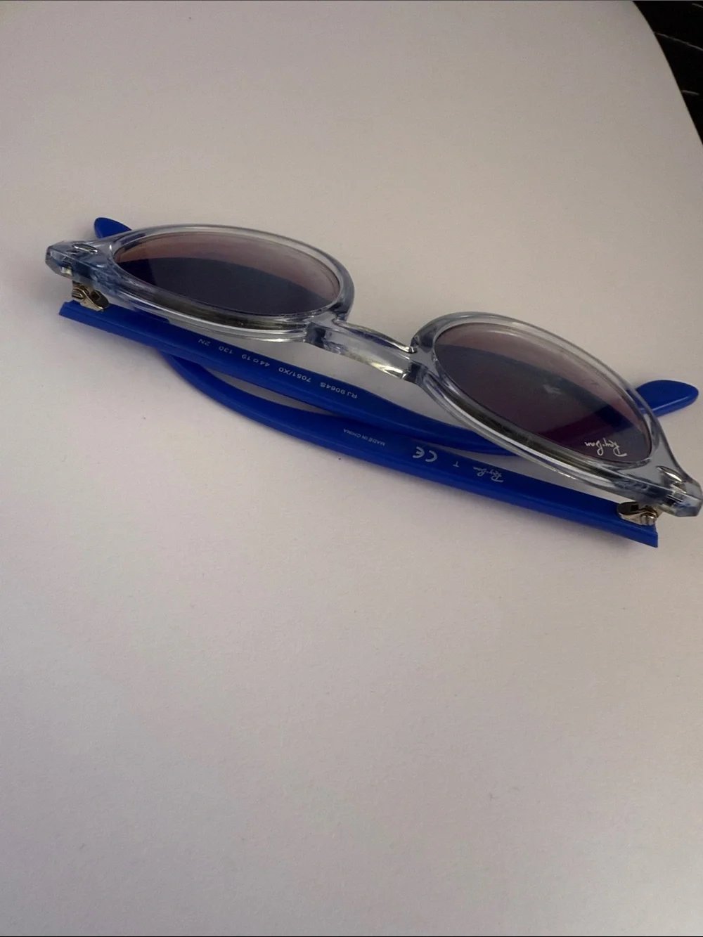 Ray-Ban Clear Frame Sunglasses with Blue Temples and Mirrored Lenses